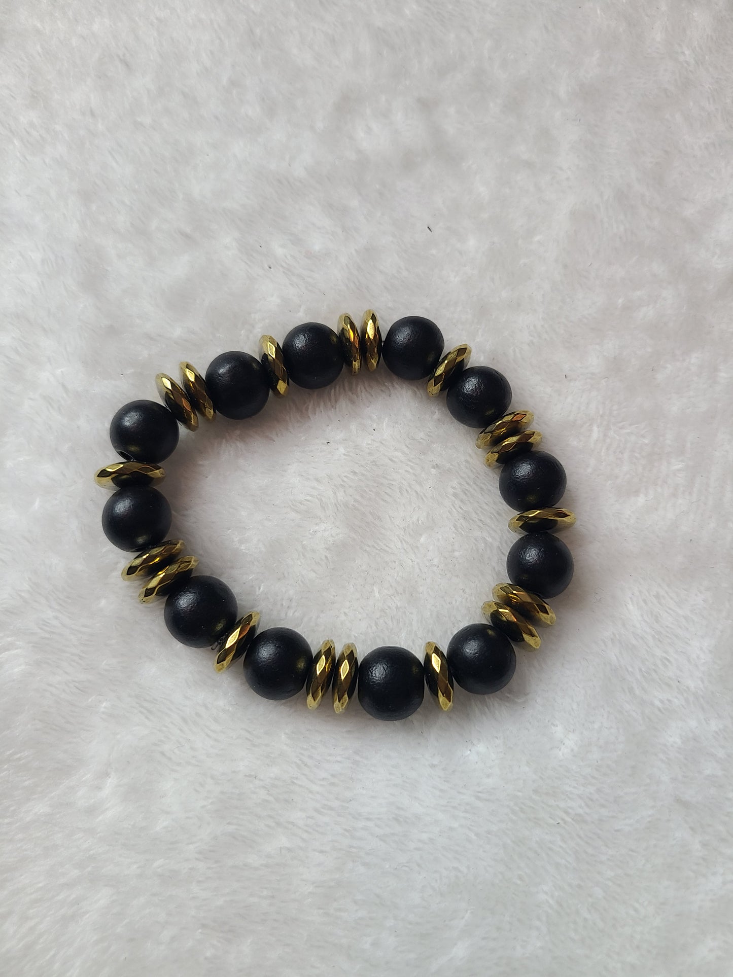 Black wood and gold spacer bracelet